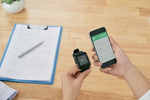 A wearable device is being configured next to a handheld.